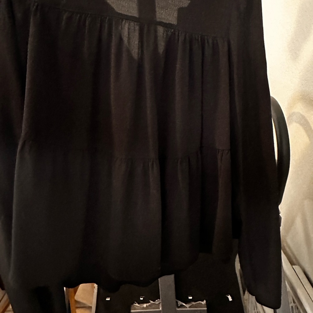 GAP Black ruffled  new blouse . Never been worn.